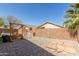 Lush backyard with artificial turf, comfortable swing, and well-manicured gravel for a relaxing outdoor experience at 3284 W Five Mile Peak Dr, San Tan Valley, AZ 85144