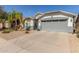 Single-story home showcasing a xeriscaped front yard, gray accents and attached two-car garage at 3284 W Five Mile Peak Dr, San Tan Valley, AZ 85144