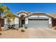 Charming single-story home featuring a well-maintained front yard and a two-car garage at 3284 W Five Mile Peak Dr, San Tan Valley, AZ 85144