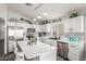 Bright kitchen featuring stainless steel appliances, island and white cabinetry at 3284 W Five Mile Peak Dr, San Tan Valley, AZ 85144