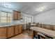 Cozy dining area with wooden chairs and table, adjacent to the kitchen at 3330 E Main St # 7, Mesa, AZ 85213