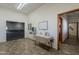 A hallway featuring a water fountain, bulletin board, table with literature, and doorways at 3330 E Main St # 7, Mesa, AZ 85213