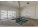 Indoor hot tub with an exit door leading to an outdoor swimming pool area at 3330 E Main St # 7, Mesa, AZ 85213