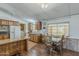 Bright kitchen and dining area with wood cabinets and modern appliances at 3330 E Main St # 7, Mesa, AZ 85213