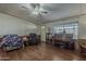 Cozy living room featuring a piano, wood flooring, and comfortable seating at 3330 E Main St # 7, Mesa, AZ 85213