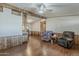 Spacious living room showing wood trim and an opening to the dining area at 3330 E Main St # 7, Mesa, AZ 85213