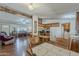 Spacious living room flowing into a kitchen with wood floors and cabinetry at 3330 E Main St # 7, Mesa, AZ 85213