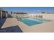 Outdoor community pool featuring ample seating and blue umbrellas for shade at 3330 E Main St # 7, Mesa, AZ 85213