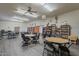 A recreation room with multiple tables, chairs, bookshelves, decor, and vinyl flooring at 3330 E Main St # 7, Mesa, AZ 85213