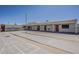 An exterior view of shuffleboard courts with benches under a clear blue sky at 3330 E Main St # 7, Mesa, AZ 85213