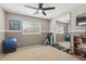 Bedroom with neutral tones, large mirror, and exercise equipment, creating a versatile space at 3336 E Linda Ct, Gilbert, AZ 85234