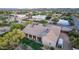 Aerial view of a neighborhood with a well maintained roof with a large backyard featuring desert vegetation and patio at 38301 N 15Th Ave, Phoenix, AZ 85086