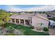 Back aerial view of a landscaped backyard, covered patio, desert vegetation and a place to park your trailer at 38301 N 15Th Ave, Phoenix, AZ 85086