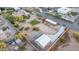 A bird's eye view showcases horse facilities and a large lot, surrounded by lush desert landscaping and neighborhood homes at 38301 N 15Th Ave, Phoenix, AZ 85086