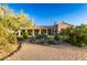 The desert-landscaped backyard offers a harmonious blend of native flora and outdoor living space at 38301 N 15Th Ave, Phoenix, AZ 85086