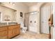 Neutral bathroom featuring a shower-tub combo and light wood vanity at 38301 N 15Th Ave, Phoenix, AZ 85086