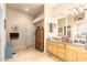 Bathroom with double sink vanity, granite counters, and built-in storage at 38301 N 15Th Ave, Phoenix, AZ 85086