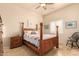 Comfortable bedroom featuring a ceiling fan, neutral color palette, and a window with plantation shutters at 38301 N 15Th Ave, Phoenix, AZ 85086