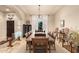 Formal dining room featuring a large wooden table, tile flooring, and decorative chandelier at 38301 N 15Th Ave, Phoenix, AZ 85086