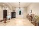 Spacious dining room with travertine floors, archway, and well-lit by a large window at 38301 N 15Th Ave, Phoenix, AZ 85086