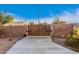 Gated driveway entrance with tall brick walls and a wooden gate, providing privacy and security to the property at 38301 N 15Th Ave, Phoenix, AZ 85086