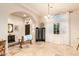 Welcoming entryway with travertine floors, arched entrance, and decorative bench at 38301 N 15Th Ave, Phoenix, AZ 85086