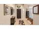 Welcoming foyer with decorative rug, dark wood accents, and tiled flooring at 38301 N 15Th Ave, Phoenix, AZ 85086