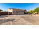 Desert home features a three-car garage, xeriscaping and fenced yard at 38301 N 15Th Ave, Phoenix, AZ 85086