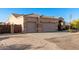 Desert home features a three-car garage and xeriscaping at 38301 N 15Th Ave, Phoenix, AZ 85086