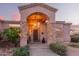 Charming front porch with stone accents, desert landscaping and unique architectural design at 38301 N 15Th Ave, Phoenix, AZ 85086