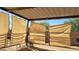 Horse shelter includes sun-protective fabric panels and metal frame, offering shady place to relax outdoors at 38301 N 15Th Ave, Phoenix, AZ 85086