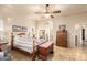 Main bedroom showcasing wood furniture, light-colored walls and flooring, and natural light at 38301 N 15Th Ave, Phoenix, AZ 85086