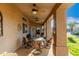 Relaxing covered patio with ceiling fans, outdoor seating, and desert views at 38301 N 15Th Ave, Phoenix, AZ 85086