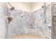 Luxurious walk-in shower featuring dual shower heads and decorative tile at 38301 N 15Th Ave, Phoenix, AZ 85086