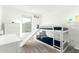 bedroom featuring a white bunk bed with a slide and dresser; a delightful space for relaxation and play at 4110 S 58Th Ln, Phoenix, AZ 85043