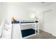 bedroom featuring a white bunk bed with a slide and built in steps for a fun and functional design at 4110 S 58Th Ln, Phoenix, AZ 85043