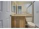 Bathroom featuring wooden cabinets, modern fixtures, and a standing shower at 4417 W Lawler Loop, Phoenix, AZ 85083