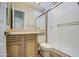 Bathroom featuring wooden cabinets, modern fixtures, and a glass standing shower at 4417 W Lawler Loop, Phoenix, AZ 85083