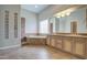 Bathroom with double sink vanity, tile floors, and soaking tub by window at 4417 W Lawler Loop, Phoenix, AZ 85083