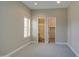 Bright bedroom with view to a bathroom and closet, neutral walls, and plush carpet at 4417 W Lawler Loop, Phoenix, AZ 85083