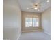 Bedroom featuring plush carpet, ceiling fan, and window with shutters at 4417 W Lawler Loop, Phoenix, AZ 85083