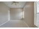 Spacious bedroom featuring neutral walls, plush carpet, and bright, natural light from the window at 4417 W Lawler Loop, Phoenix, AZ 85083