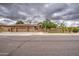 Attractive single-story home with three-car garage, desert landscaping, and stone accents at 4417 W Lawler Loop, Phoenix, AZ 85083