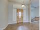 Spacious foyer with tiled flooring, a decorative light fixture, and a wooden front door at 4417 W Lawler Loop, Phoenix, AZ 85083