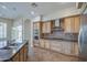 Modern kitchen with granite countertops, stainless steel appliances, and custom cabinets at 4417 W Lawler Loop, Phoenix, AZ 85083