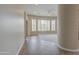 Neutral room with tile flooring, large windows with shutters, and architectural column at 4417 W Lawler Loop, Phoenix, AZ 85083