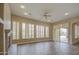 Bright living room with fireplace, tile floors, fan, and slider to patio at 4417 W Lawler Loop, Phoenix, AZ 85083