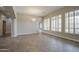 Open-concept living space with tile flooring, recessed lighting, and ample natural light at 4417 W Lawler Loop, Phoenix, AZ 85083