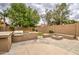 Relax and enjoy the outdoor kitchen, complete with grill, counter space and fire pit with bench seating at 4417 W Lawler Loop, Phoenix, AZ 85083