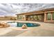 Desert home's inviting pool has rock accents, and is ready for swimming or just relaxing by the water at 4417 W Lawler Loop, Phoenix, AZ 85083